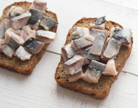 Two open sandwiches with herringの写真素材