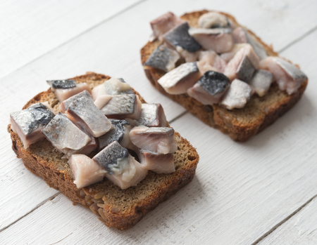 Two open sandwiches with herringの写真素材