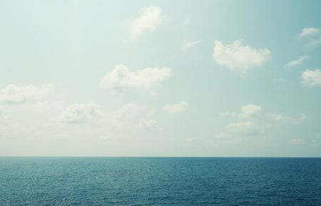 Blue sky with clouds and seaの写真素材