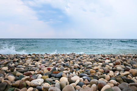 Pebble beach and blue seaの写真素材