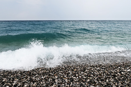 Pebble beach and blue seaの写真素材