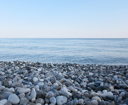 Pebble beach and blue seaの写真素材