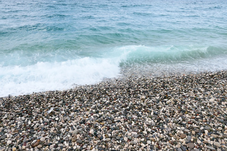 Pebble beach and blue seaの写真素材
