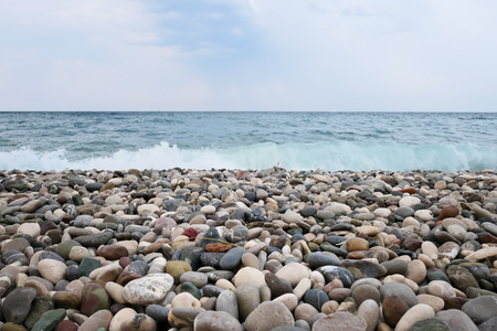 Pebble beach and blue seaの写真素材