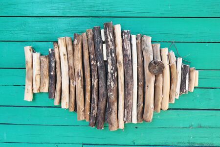 Wooden fish on a wallの写真素材