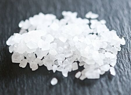 Heap of sea salt on slateの写真素材