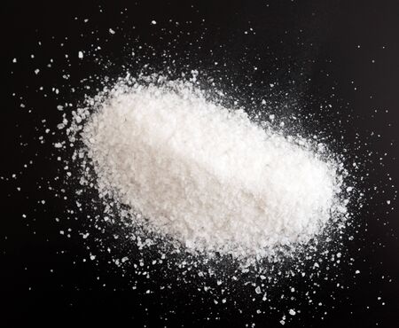 Pile of an stone salt on a black backgroundの写真素材