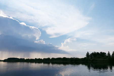 Cloudy sky over lakeの写真素材