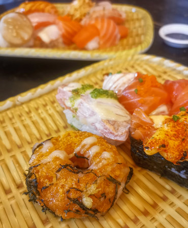 Plates of sushi with fresh salmonの写真素材