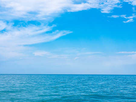 Blue sky over calm seaの写真素材