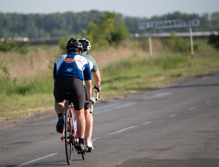 Couple ride a tandem bikeの写真素材