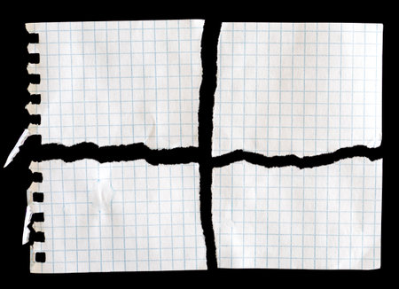 Notebook papers with torn edges on black backgroundの写真素材