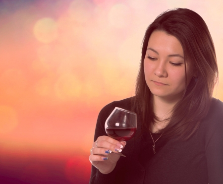 beautiful woman with glass red wine