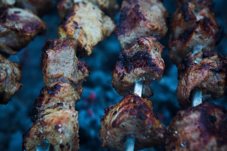 A barbecue meat slices prepare on fireの写真素材