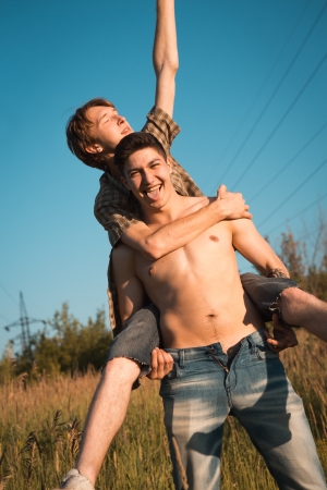 Portrait of a happy gay couple outdoorsの写真素材