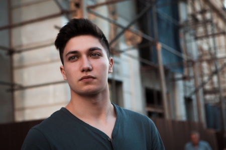 Young attractive man in urban backgroundの写真素材