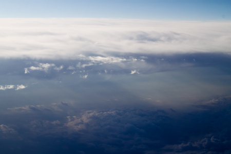 dramatic blue sky with clouds and sun raysの写真素材