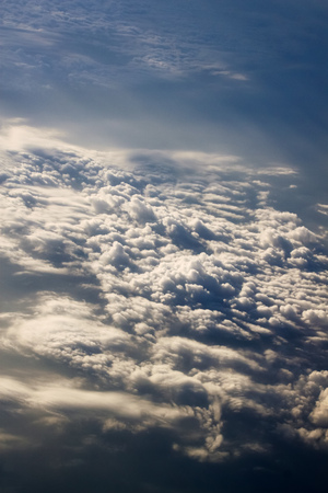 dramatic blue sky with clouds and sun raysの写真素材