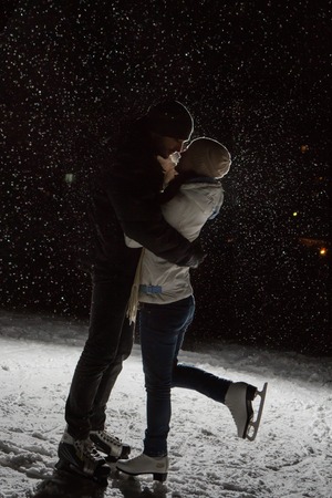 young couple in winter skate rinkの写真素材