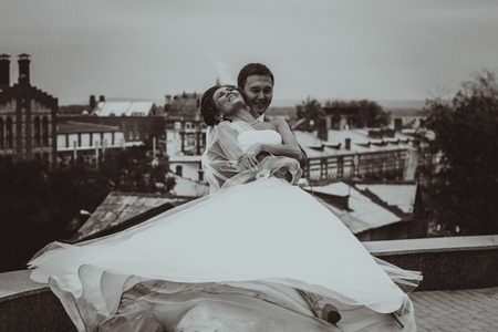 Young wedding couple kissing. Bright white colors.の写真素材