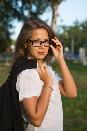 beautiful young girl reading a book on the natureの写真素材
