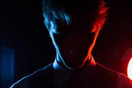 Style man silhouette portrait with red and blue filtersの写真素材
