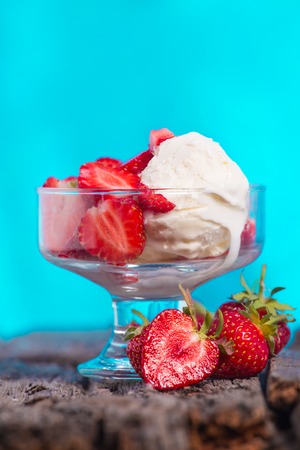 Ice cream with strawberries and whipped creamの写真素材