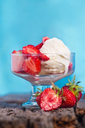 Ice cream with strawberries and whipped creamの写真素材