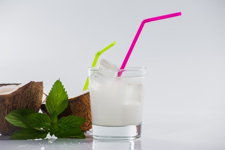 Coconut cocktail on white background with mintの写真素材