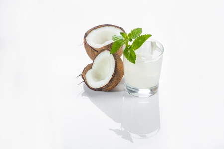 Coconut cocktail on white background with mintの写真素材