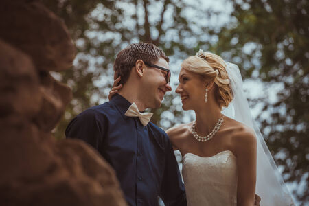 Beautiful young  bride and  groom in a parkの写真素材
