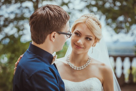 Beautiful young  bride and  groom in a parkの写真素材