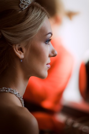 bride in a beautiful dress near the  windowの写真素材