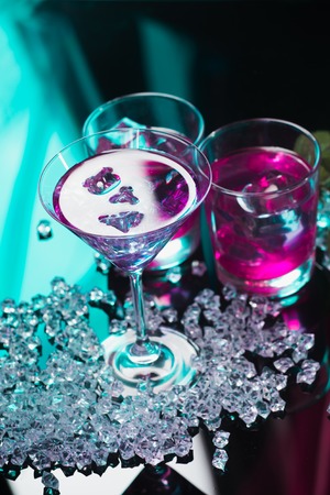 Violet coctail with ice cubesの写真素材