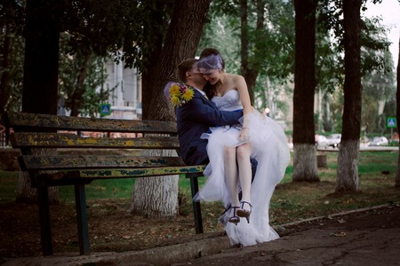 the newly married couple  standing at parkの写真素材