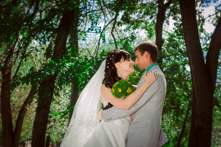 Married Couple in forest  embracingの写真素材
