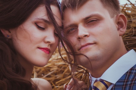 bride and groom near hay barnの写真素材