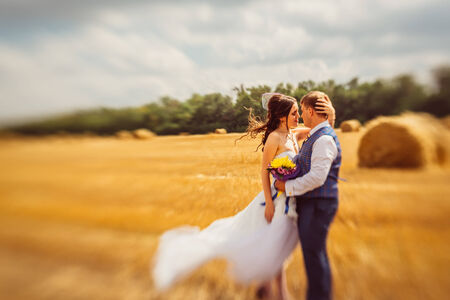 bride and groom near hay barnの写真素材