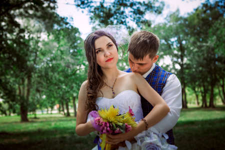 Married Couple in forest  embracingの写真素材