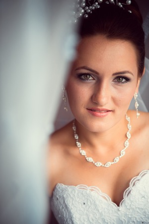 Happy Bride looking in  windowの写真素材