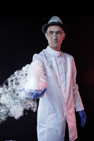 Smiling man  scientist with dry iceの写真素材