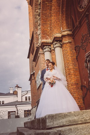 A beautiful bride and handsome groom  at church during weddingの写真素材