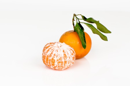 fresh mandarin with leaf isolated  on whiteの写真素材