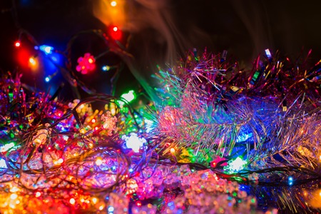 bright colored garlands bulb shines in the dark background,  selective focusの写真素材
