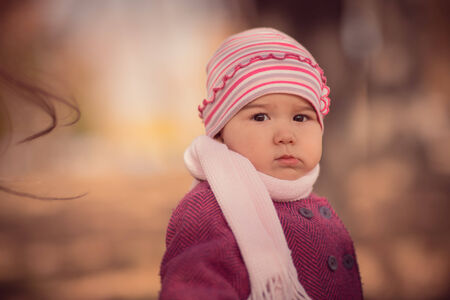 Beautiful outdoor autumn portrait of adorable  toddler girlの写真素材