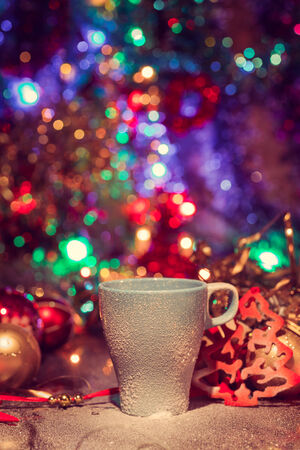 Cup of tasty hot cocoa, on wooden table,  on shiny backgroundの写真素材