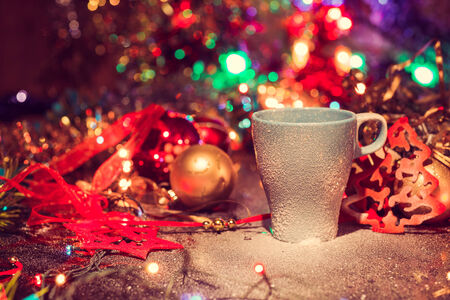 Cup of tasty hot cocoa, on wooden table,  on shiny backgroundの写真素材