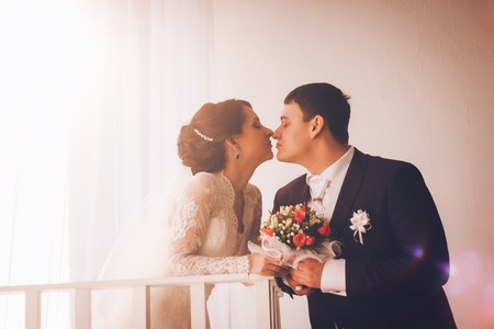 Portrait of Caucasian groom  and bride embracingの写真素材