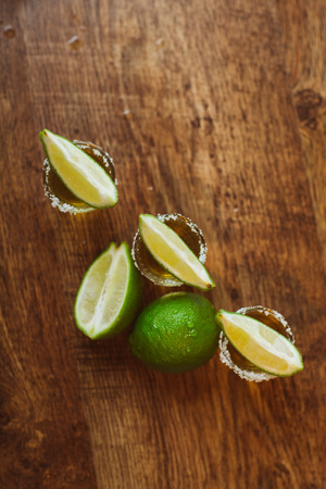 tequila , lime and salt on wooden  table selective focusの写真素材