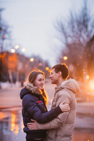 Portrait of young beautiful couple in an autumn rainy dayの写真素材